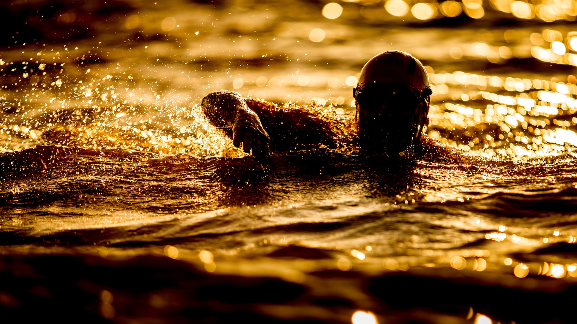 the image shows a man at the swimming race