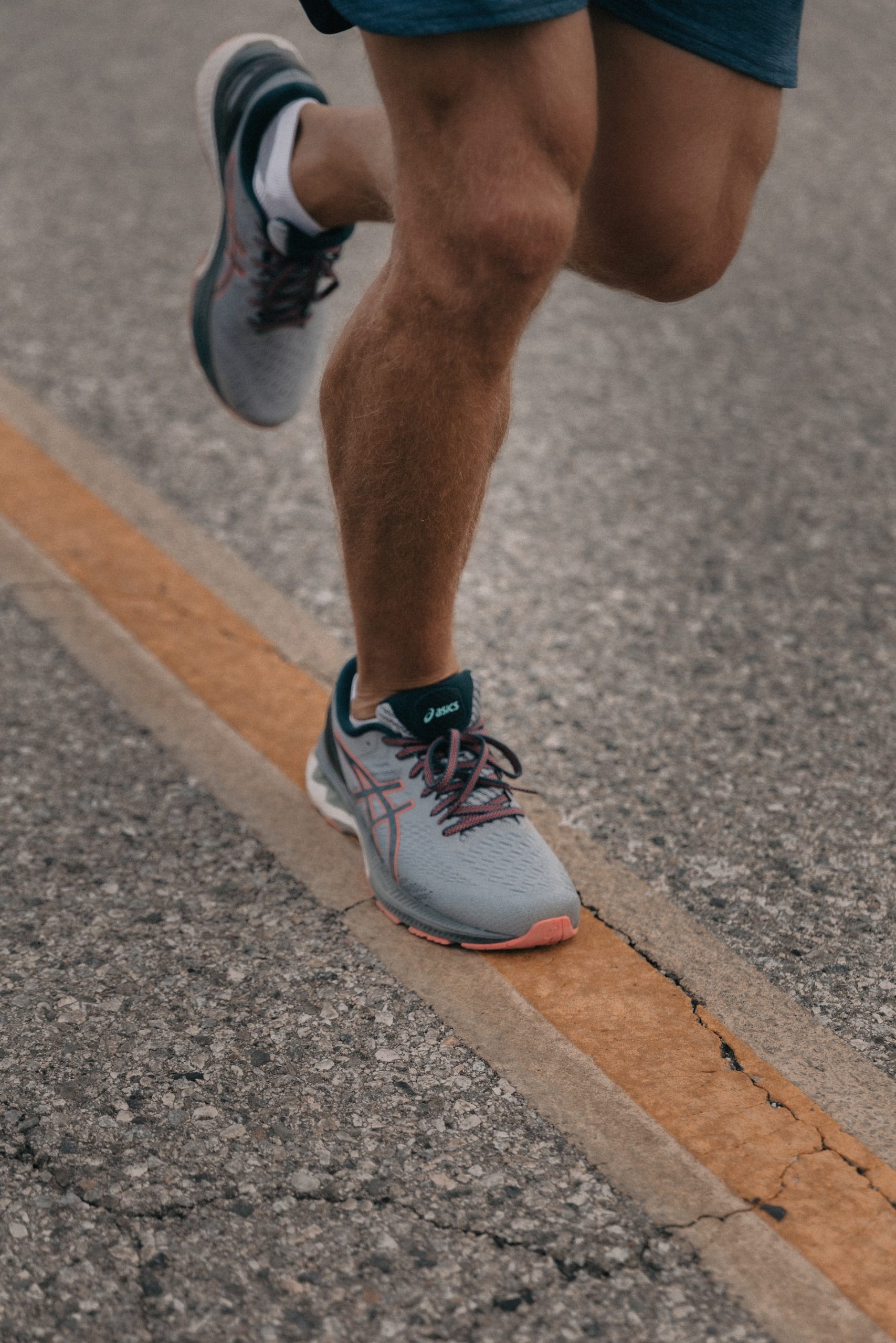 the image shows a male feet running
