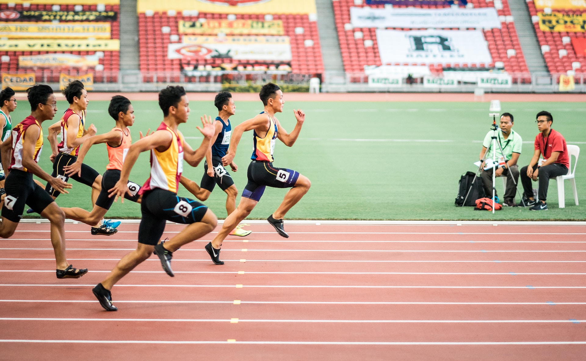 the image shows a male running triathlon competition