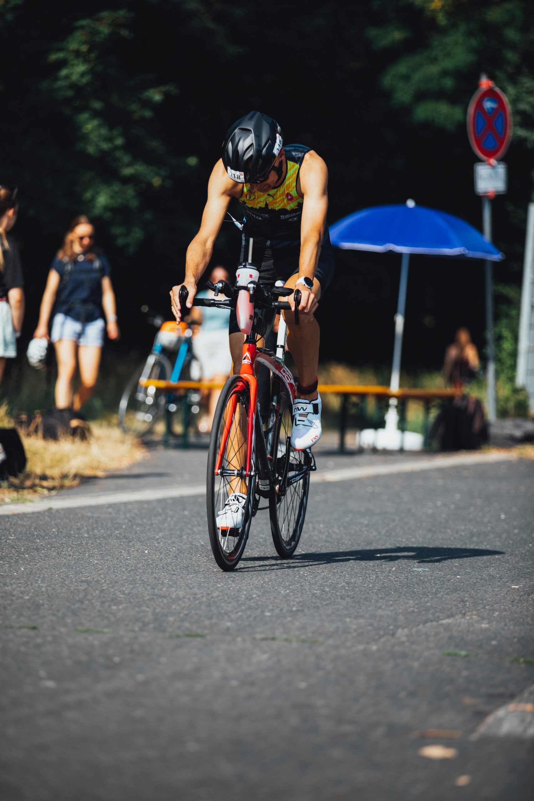 the image shows a man doing bicycling triathlon