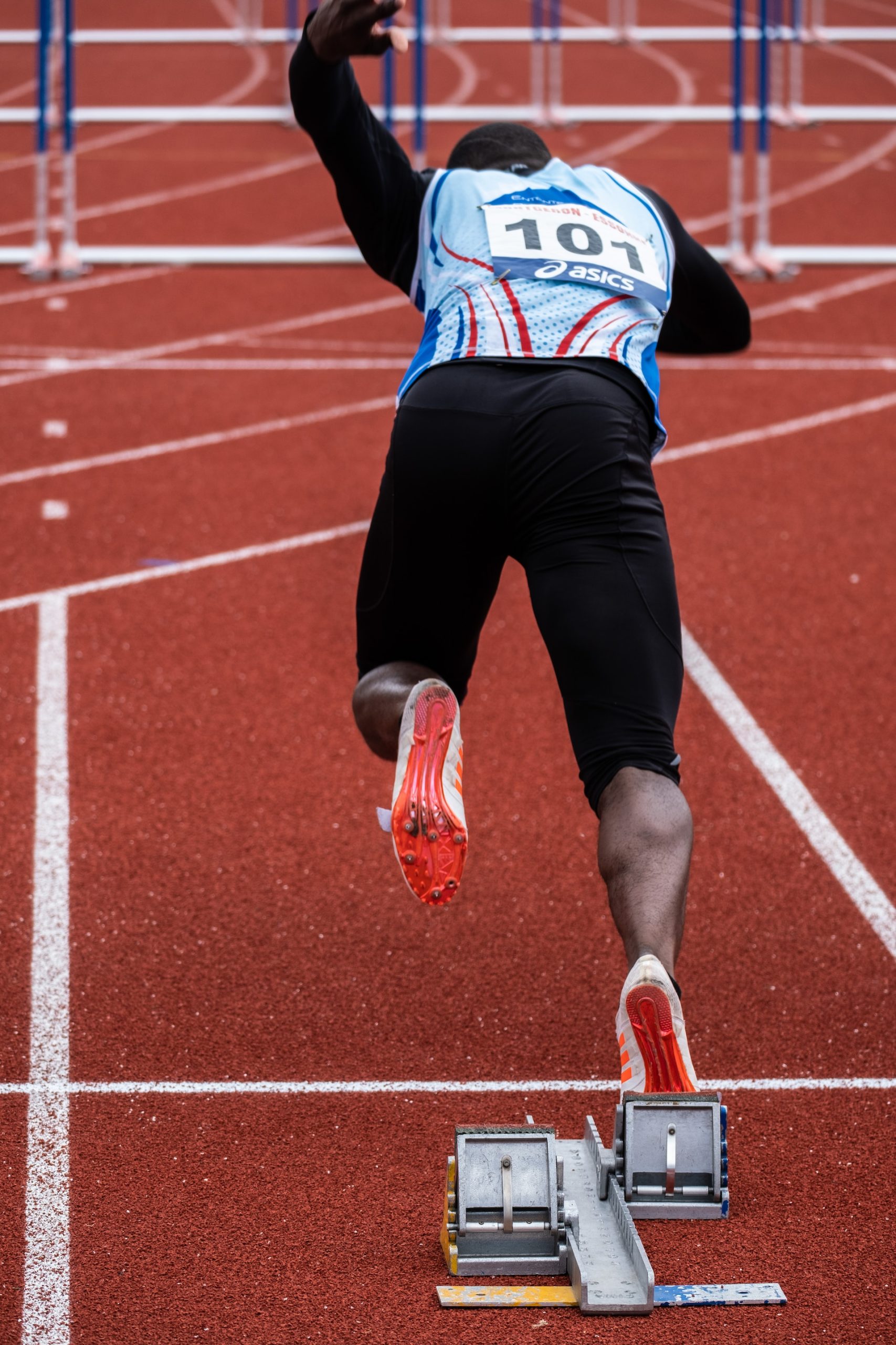 the image shows a man at the running race competition