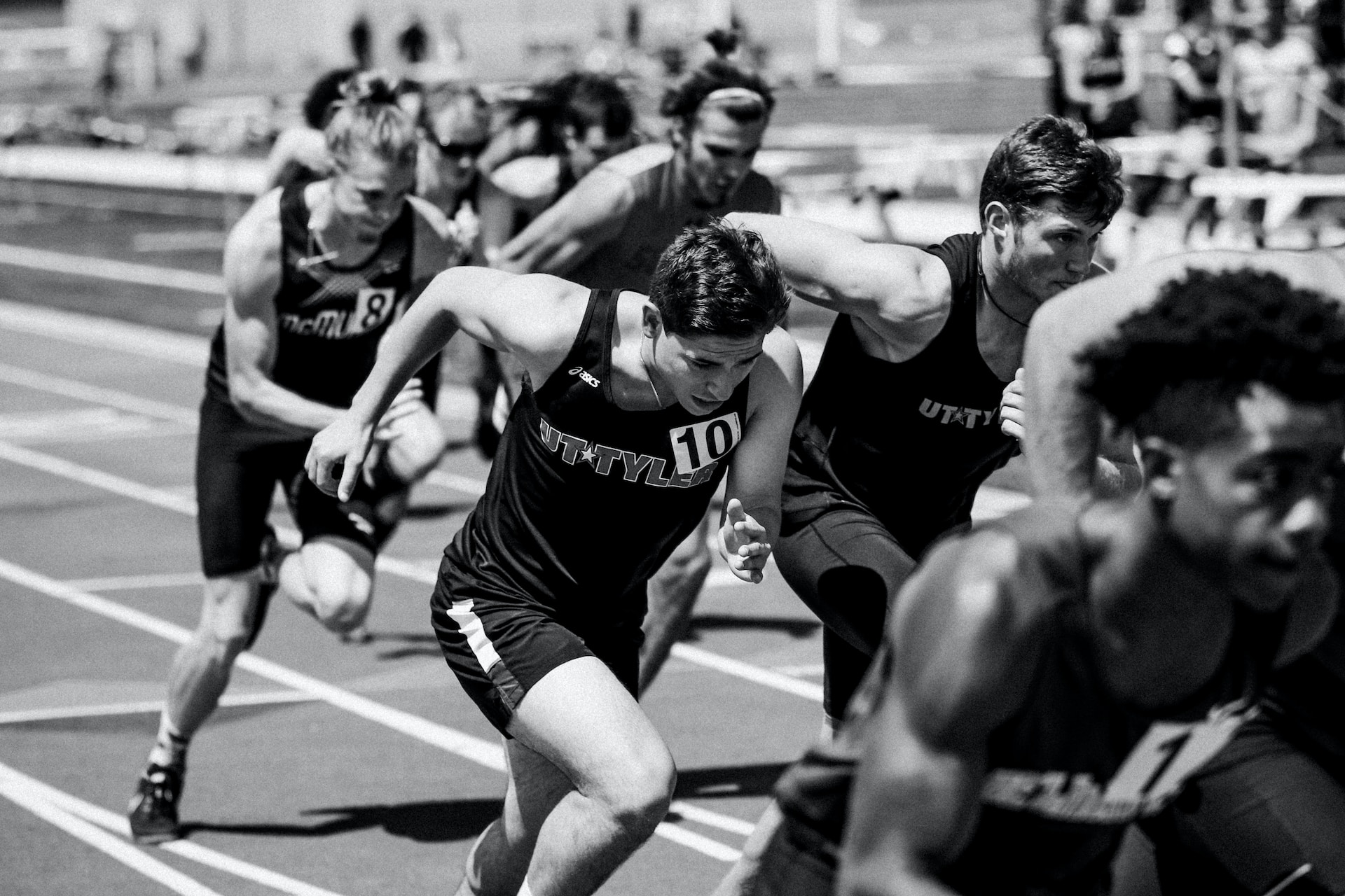 the image shows a male running triathlon race