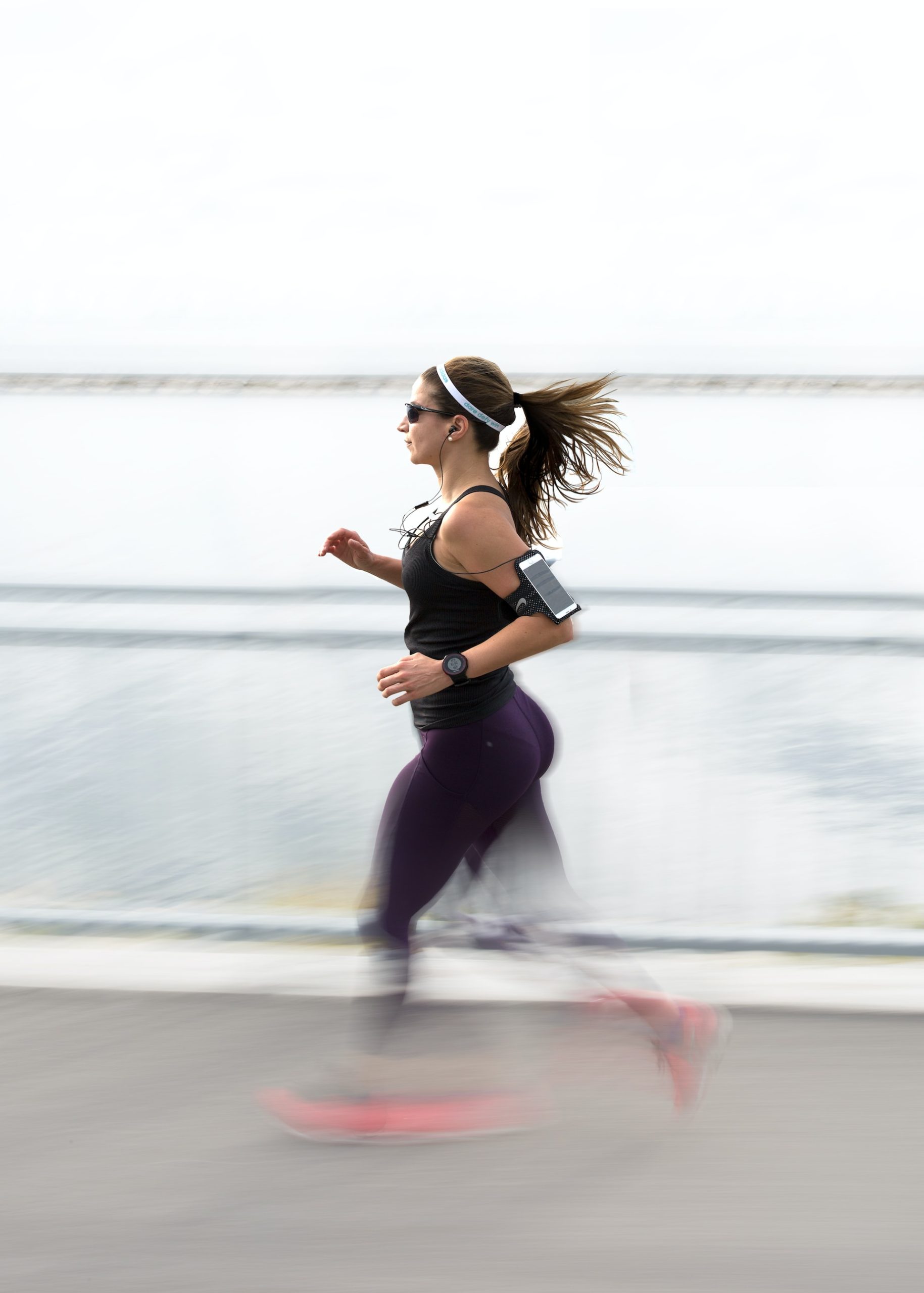 the image shows a running female athlete