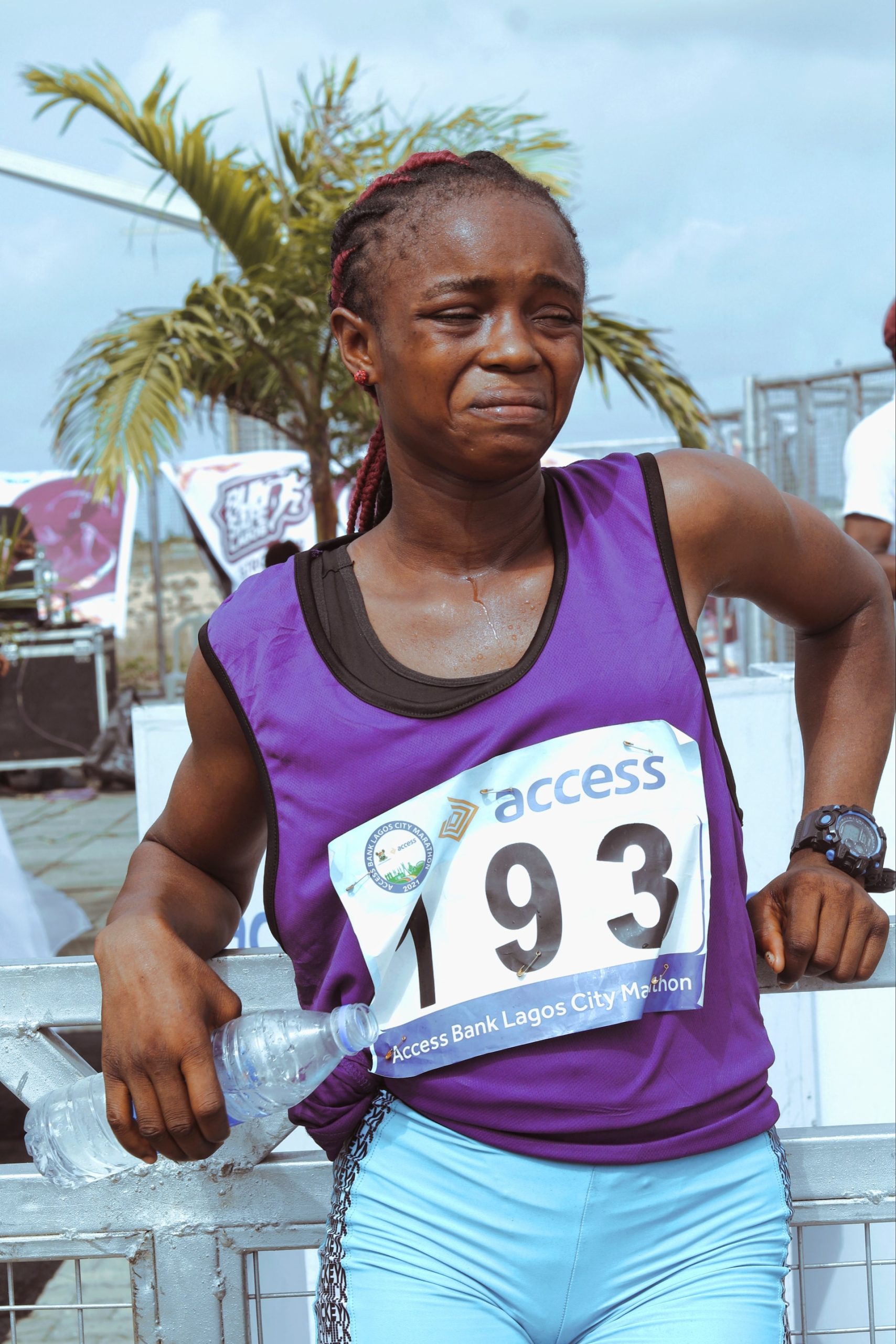 the image shows a female sportswoman after a running triathlon marathon